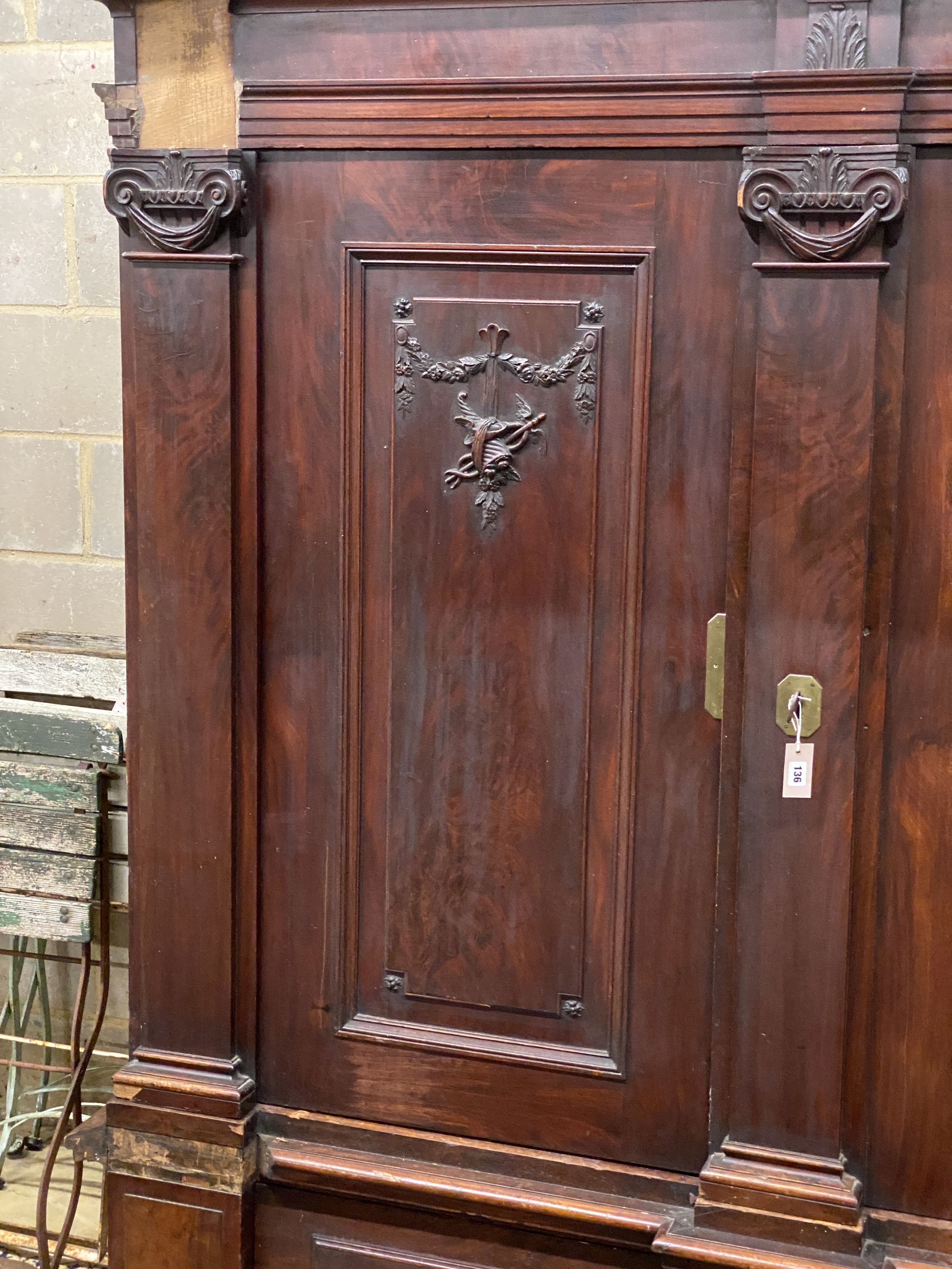 An 18th century carved walnut shrank, length 220cm, depth 73cm, height 216cm
